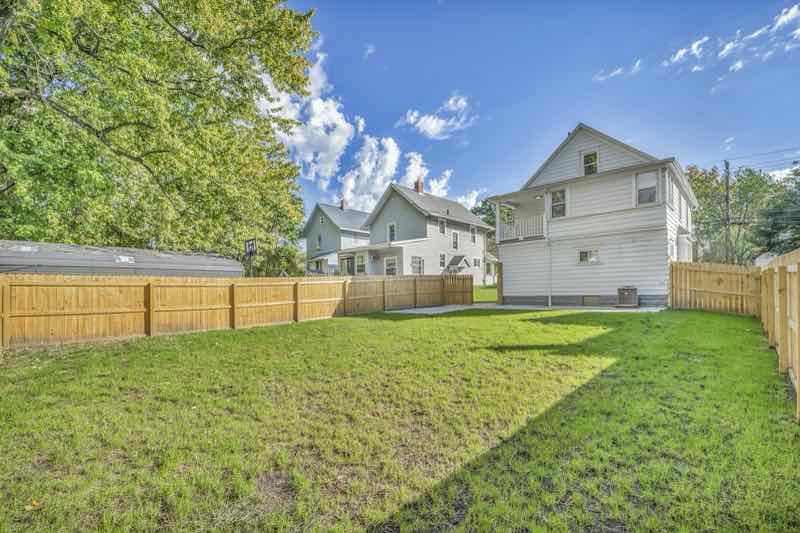 Cedar privacy fence around a large backyard